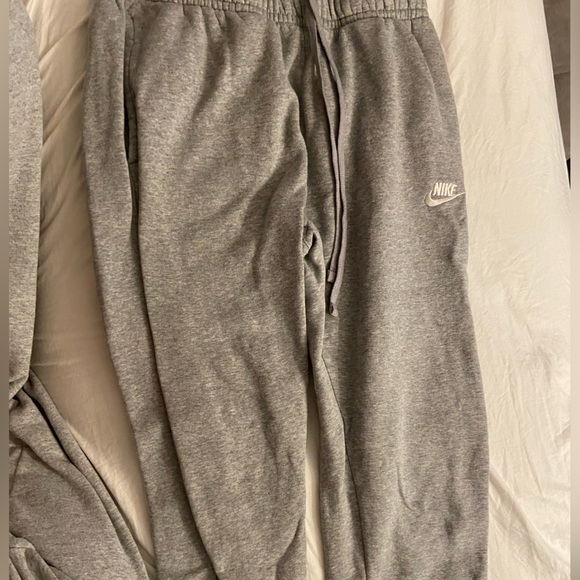 Gray Nike sweatpants with a pocket on the back. - Picture 2 of 3